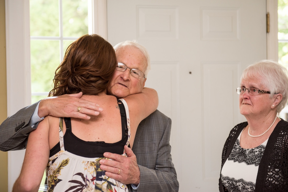bride with grandparents on her wedding day