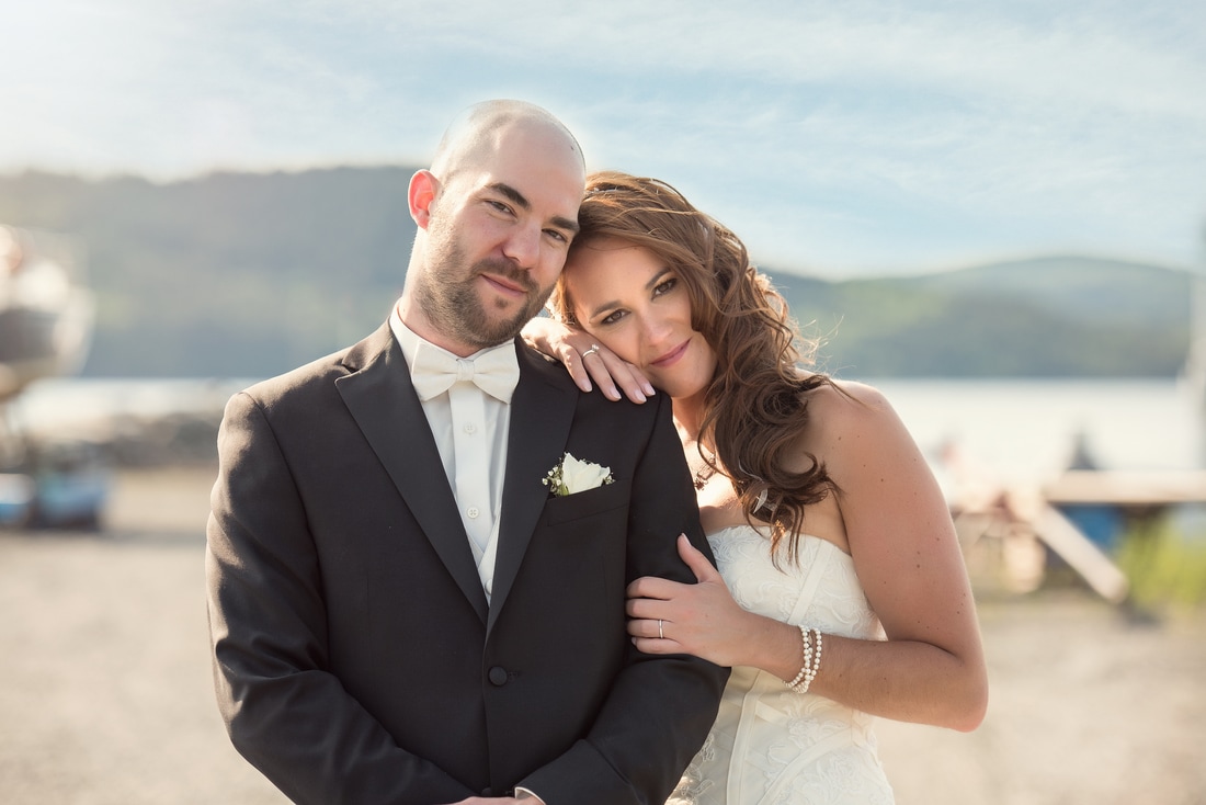 Bride and groom on their wedding day and the Rothesay Yacht club