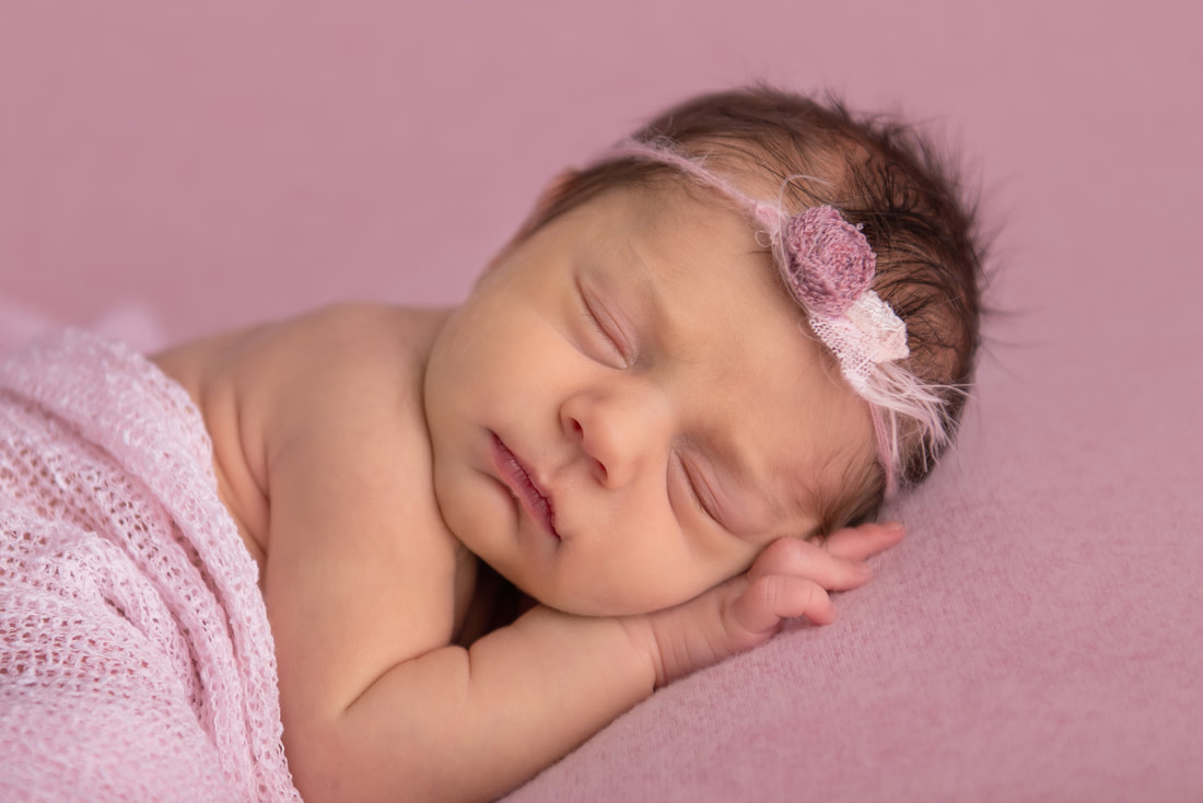 newborn-girl-sleeping-pink-baby-photographer